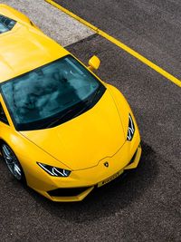 High angle view of yellow car on street