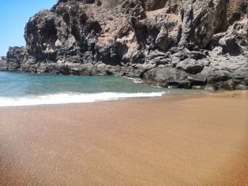 Scenic view of beach against sky