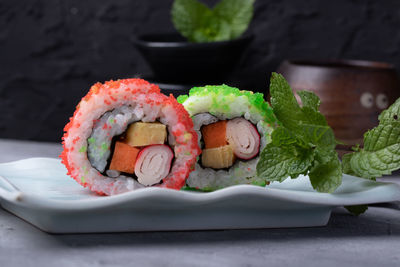 Close-up of sushi served on table