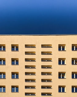 Low angle view of building against blue sky