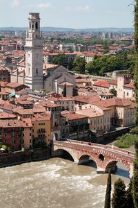 Arch bridge over river in city