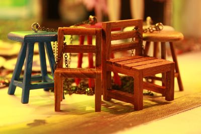 Close-up of empty chairs and table