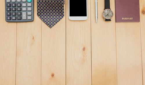 Close-up of personal accessories on wooden table