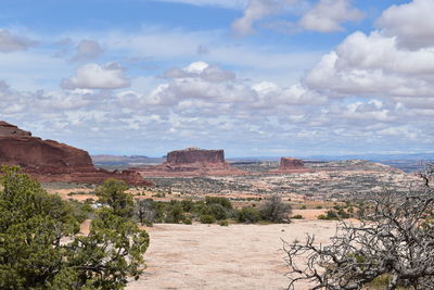 Scenic view of landscape against cloudy sky