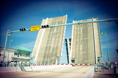 Low angle view of building against sky bridge drawbridge up 