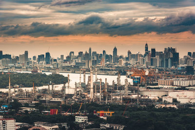 High angle view of buildings in city during sunset