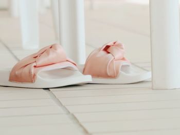 Close-up of white flip-flops