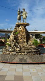 Low angle view of statue against sky