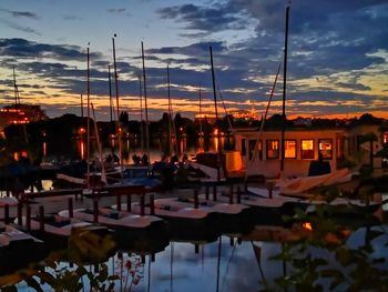 Boats in marina at sunset