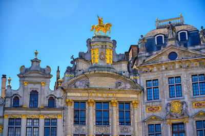 Low angle view of building against blue sky