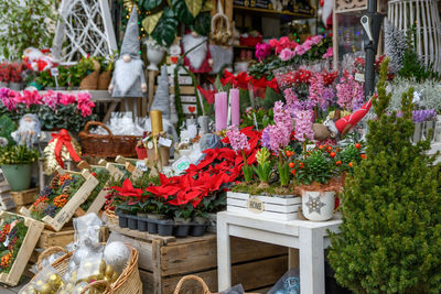 Flowers and decorations on display in front o flower shop