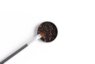 Close-up of coffee cup against white background