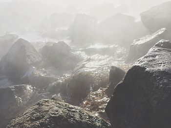 Close-up of water cascading over stones