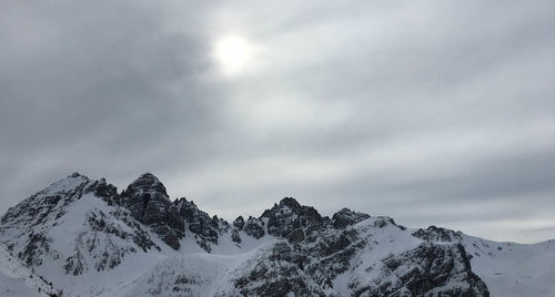 Scenic view of snow covered mountains against sky