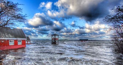 Scenic view of sea against cloudy sky