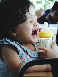 Close-up of cute girl holding ice cream