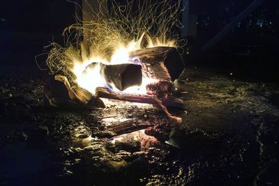 Close-up of illuminated bonfire at night