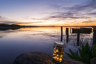 Scenic view of lake against sky during sunset