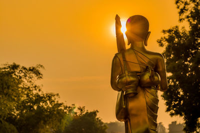 Statue against sky during sunset