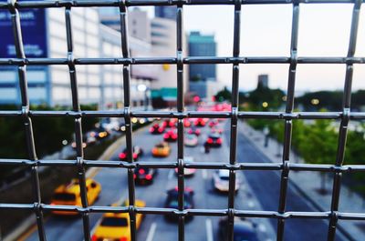 Full frame shot of fence against buildings