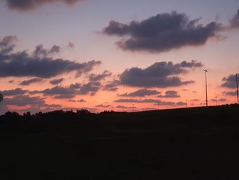 Scenic view of silhouette landscape against sky during sunset