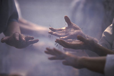 Cropped image of people getting acupuncture treatment