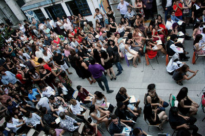 High angle view of people walking on street in city