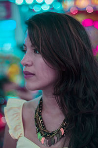 Close-up of young woman looking away