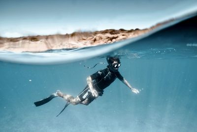 Man swimming in sea