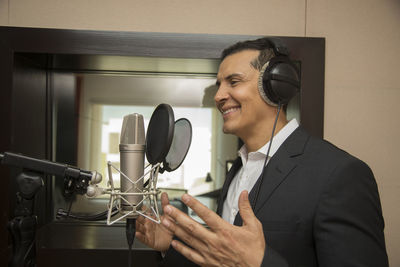 Portrait of smiling man using mobile phone