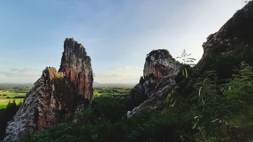 Panoramic view of rock formations against sky