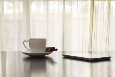 Coffee cup on table