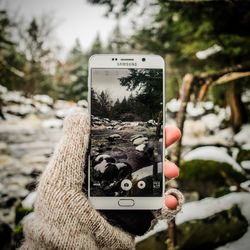 Close-up of smart phone on road