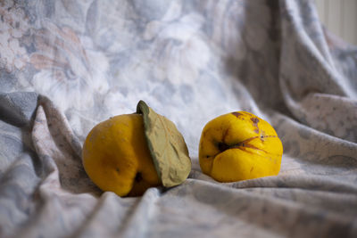 Close-up of yellow fruit on bed
