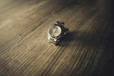 High angle view of clock on table