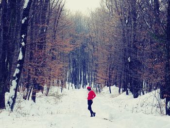 Full length of woman on snowy field during winter