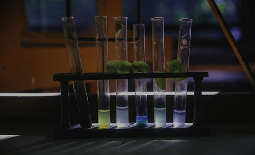Chemical test tube in chemistry lab beside the window