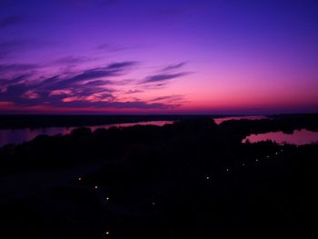 Scenic view of silhouette landscape against sky at sunset