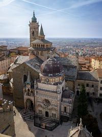 High angle view of church and buildings in city