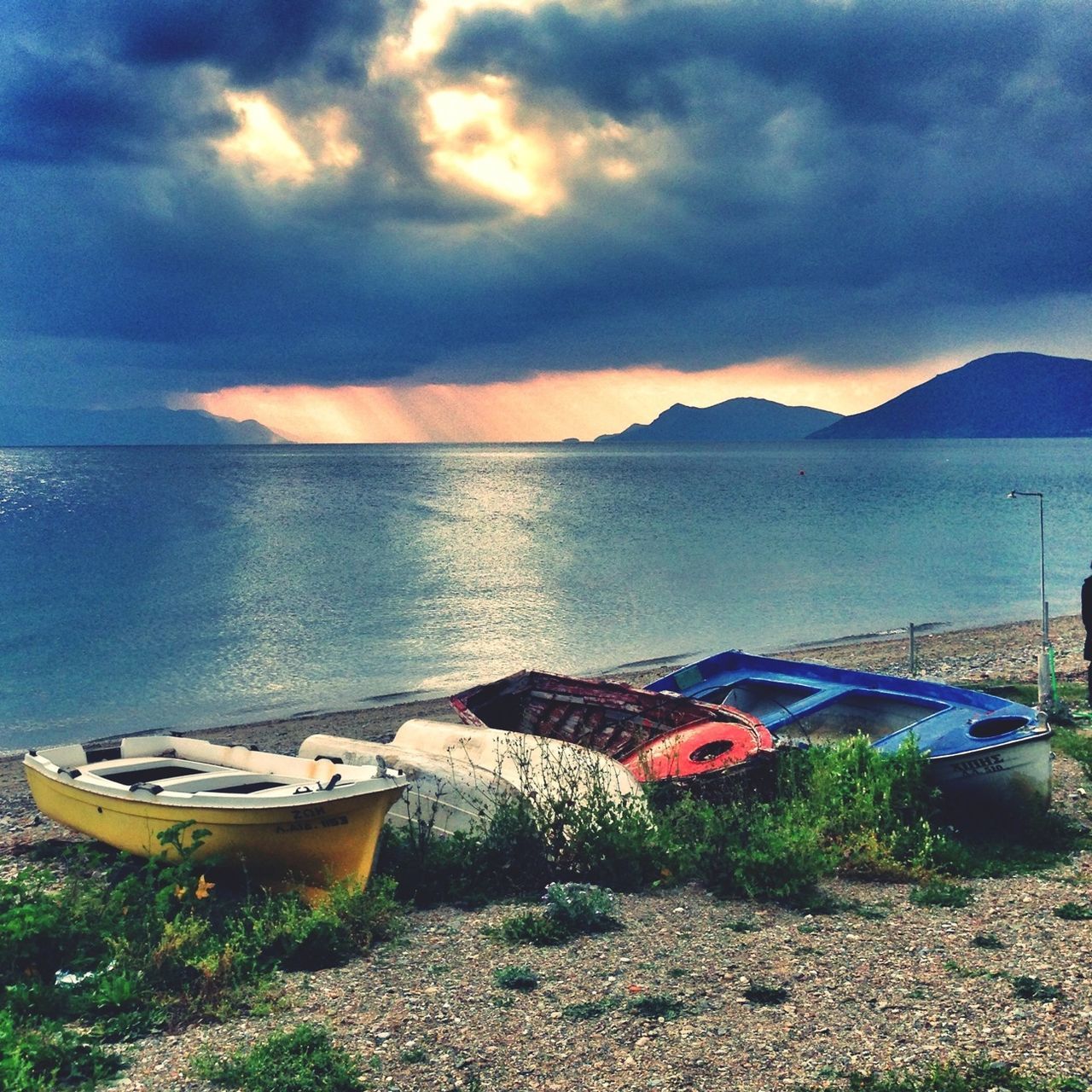 sky, water, cloud - sky, nautical vessel, tranquility, tranquil scene, scenics, moored, beauty in nature, sea, boat, cloudy, nature, cloud, transportation, sunset, mode of transport, lake, shore, idyllic