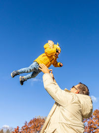 Low angle view of statue against clear blue sky