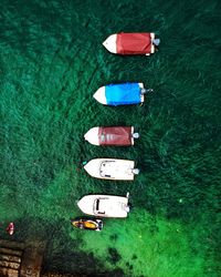 Directly above of boats moored on sea