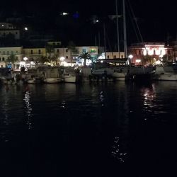 Boats in harbor at night