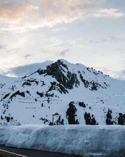 Scenic view of snow covered mountains against sky