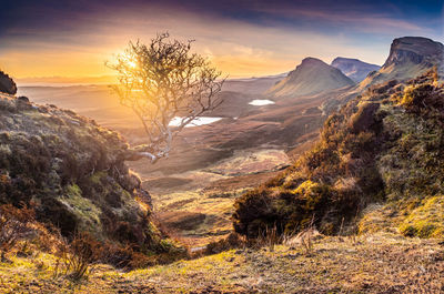 Scenic view of mountains against sky during sunset