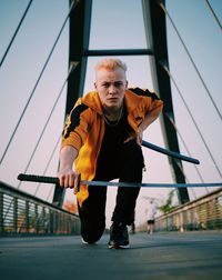 Portrait of man against railing