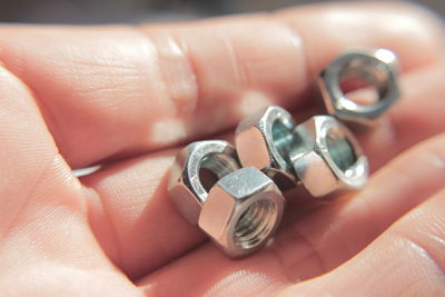 Close-up of bolts in a hand