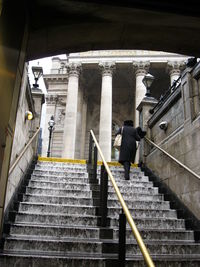 Man walking up stairs