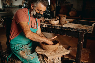 Man working on barbecue grill