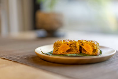 Close-up of cake slice in plate on table
